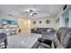 Living room with large TV and comfy seating at 203 North Cir, Davenport, FL 33837