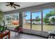Spacious screened porch overlooking a backyard with a shed at 203 North Cir, Davenport, FL 33837