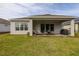 Covered patio with seating area and grill, perfect for outdoor entertaining at 2051 Flora Pass Pl, Kissimmee, FL 34747