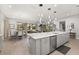 Open concept kitchen with large island and stainless steel appliances at 2051 Flora Pass Pl, Kissimmee, FL 34747