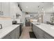 Modern kitchen with gray and white cabinets and a large island at 2051 Flora Pass Pl, Kissimmee, FL 34747