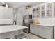 Kitchen with white cabinets, stainless steel appliances, and quartz countertops at 2051 Flora Pass Pl, Kissimmee, FL 34747