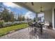 Covered patio with seating area, ceiling fan, and view of backyard at 2051 Flora Pass Pl, Kissimmee, FL 34747