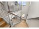 A bright staircase with wood treads leads to the lower level of this home at 2112 Celebration Blvd, Celebration, FL 34747