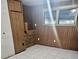 Bedroom with wood paneling walls and tile floor at 215 4Th St, Orlando, FL 32824