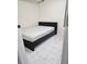 Simple bedroom with a double bed and tile floor at 215 4Th St, Orlando, FL 32824