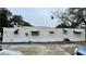 Tan mobile home with three windows and central door at 215 4Th St, Orlando, FL 32824