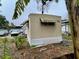 Tan mobile home with a white lattice fence at 215 4Th St, Orlando, FL 32824