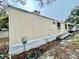 Tan mobile home with a long side view at 215 4Th St, Orlando, FL 32824