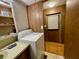 White washer and wood paneling in this laundry room at 215 4Th St, Orlando, FL 32824