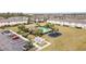 Community pool, playground, and parking lot are featured in this aerial view at 2226 Seven Oaks Dr, St Cloud, FL 34772