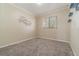 Simple bedroom with neutral walls, carpet, and window coverings at 2226 Seven Oaks Dr, St Cloud, FL 34772