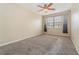 Spacious bedroom with neutral walls, carpet flooring, and ceiling fan at 2226 Seven Oaks Dr, St Cloud, FL 34772