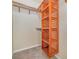 Walk-in closet with wooden shelves and hanging rods at 2226 Seven Oaks Dr, St Cloud, FL 34772