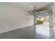 Garage with open overhead door and storage shelving at 2226 Seven Oaks Dr, St Cloud, FL 34772