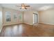 Living room with wood flooring, sliding glass doors, and ceiling fan at 2226 Seven Oaks Dr, St Cloud, FL 34772