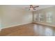 Living room with wood-look flooring and large windows at 2226 Seven Oaks Dr, St Cloud, FL 34772