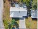 Top-down aerial view of the property showcasing the metal roof and long driveway at 2601 16Th St, St Cloud, FL 34769