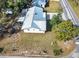 Aerial view of a well-maintained property with a metal roof and spacious yard at 2601 16Th St, St Cloud, FL 34769