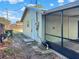Exterior view of the back of the home, featuring a screened in patio at 2601 16Th St, St Cloud, FL 34769