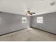 Spacious bedroom with ceiling fan and natural lighting from two windows at 2601 16Th St, St Cloud, FL 34769