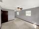 Large carpeted bedroom featuring a ceiling fan and walk-in closet at 2601 16Th St, St Cloud, FL 34769