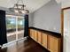 Dining room with wood floors, built-in cabinets, and sliding glass doors at 2601 16Th St, St Cloud, FL 34769