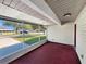 View of the screened in patio with painted floor and view of the street at 2601 16Th St, St Cloud, FL 34769