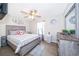 Spacious bedroom with wood-look floors and ceiling fan at 3 Pecan Drive Loop, Ocala, FL 34472