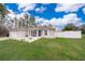 House exterior with a screened porch and grassy lawn at 3 Pecan Drive Loop, Ocala, FL 34472