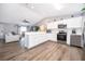 Bright kitchen features white cabinets and stainless steel appliances at 3 Pecan Drive Loop, Ocala, FL 34472