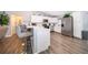 Modern kitchen with white cabinets, stainless steel appliances, and an island at 3 Pecan Drive Loop, Ocala, FL 34472