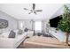 Living room featuring a gray sectional sofa and large TV at 3 Pecan Drive Loop, Ocala, FL 34472
