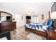 Large main bedroom with wood-look floors and en-suite bathroom at 3 Pecan Drive Loop, Ocala, FL 34472