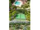 Aerial view featuring the community's pool, tennis courts, and lush greenery at 345 Forestway Cir # 106, Altamonte Springs, FL 32701