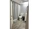 Neutral colored bathroom with updated lighting, vanity, and a shower and tub combo at 345 Forestway Cir # 106, Altamonte Springs, FL 32701