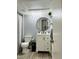 Bathroom featuring modern vanity, round mirror, and shower with curtain at 345 Forestway Cir # 106, Altamonte Springs, FL 32701