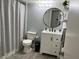Updated bathroom with modern fixtures, vanity, mirror, and shower with a curtain at 345 Forestway Cir # 106, Altamonte Springs, FL 32701