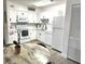 Bright kitchen with white cabinets, stainless steel appliances, and dining area at 345 Forestway Cir # 106, Altamonte Springs, FL 32701