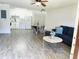 Open-concept living and kitchen area with modern decor and furniture at 345 Forestway Cir # 106, Altamonte Springs, FL 32701