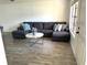 Living room with a large sofa, marble table, and modern flooring at 345 Forestway Cir # 106, Altamonte Springs, FL 32701