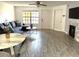 Cozy living space featuring a fireplace, a large window and stylish furnishings at 345 Forestway Cir # 106, Altamonte Springs, FL 32701