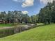 Scenic pond with fountain and lush greenery in a well maintained condo community at 345 Forestway Cir # 106, Altamonte Springs, FL 32701