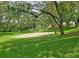 Outdoor volleyball court with net surrounded by green grass and trees at 345 Forestway Cir # 106, Altamonte Springs, FL 32701