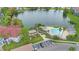 Aerial view of pool and lakeside amenities, offering a serene community setting at 3701 Castle Pines Ln # 3927, Orlando, FL 32839