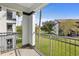 Private balcony overlooking a grassy courtyard at 3701 Castle Pines Ln # 3927, Orlando, FL 32839