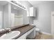 Clean bathroom with double vanity, updated fixtures and tile flooring at 3701 Castle Pines Ln # 3927, Orlando, FL 32839