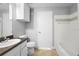 Bathroom featuring a tub-shower combo and a granite vanity with neutral paint at 3701 Castle Pines Ln # 3927, Orlando, FL 32839