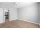 Spacious bedroom with carpeted floors and an ensuite bathroom access at 3701 Castle Pines Ln # 3927, Orlando, FL 32839