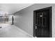 Clean condo hallway with black doors and neutral walls at 3701 Castle Pines Ln # 3927, Orlando, FL 32839